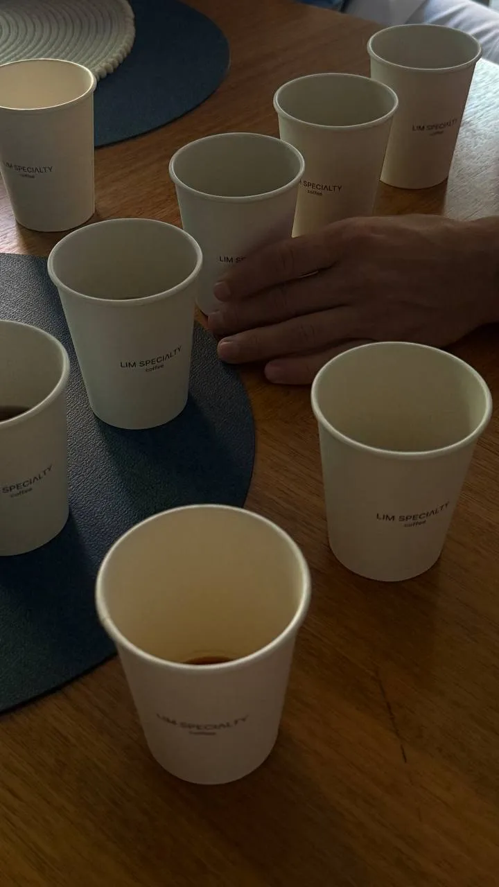 A cupping table of HEYLIM specialty coffee in tasting cups